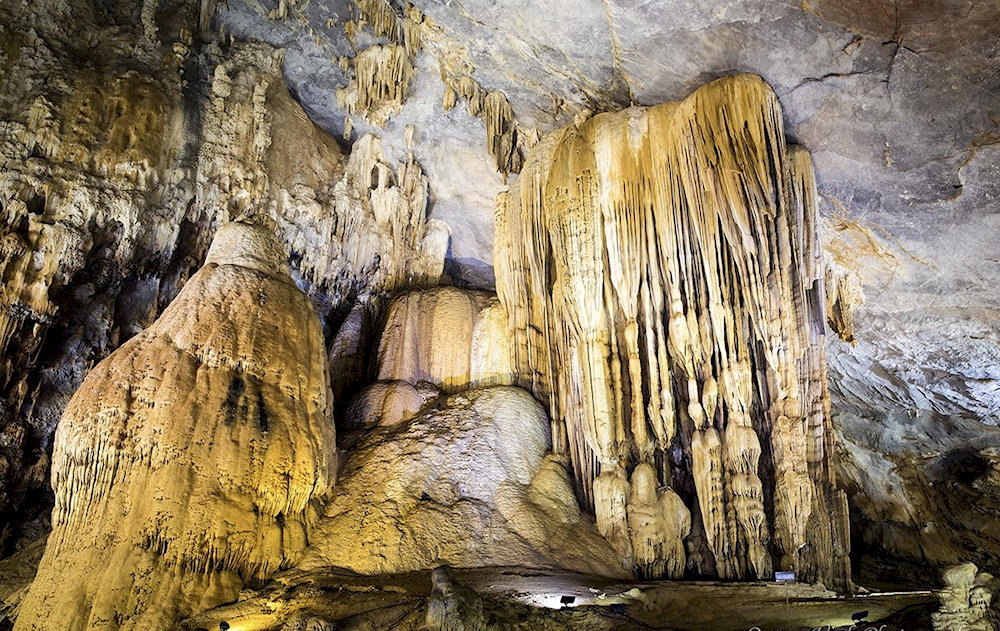 The journey to the cave is scenic, passing through quiet countryside and limestone hills